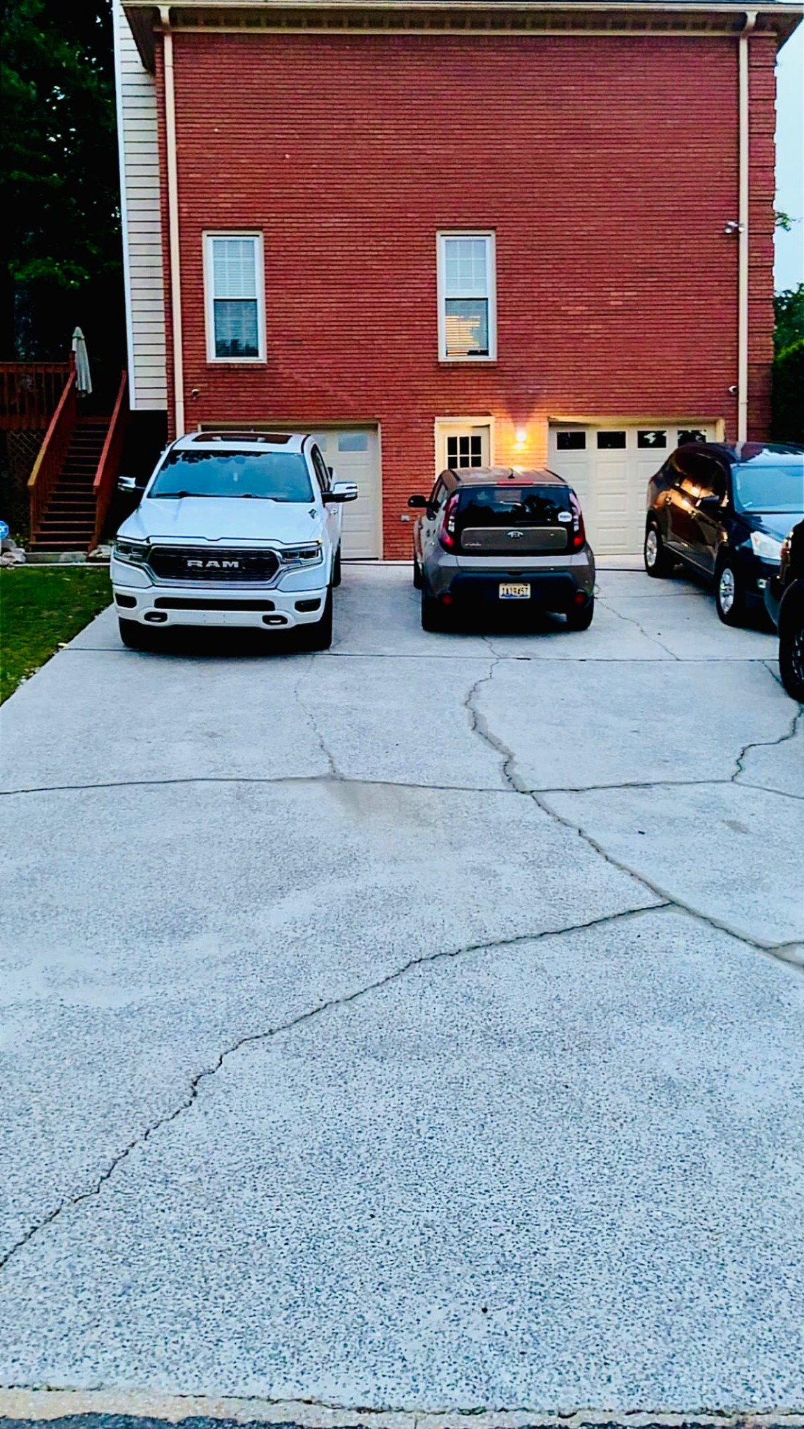 After - Concrete driveway cleaned and brightened after pressure washing